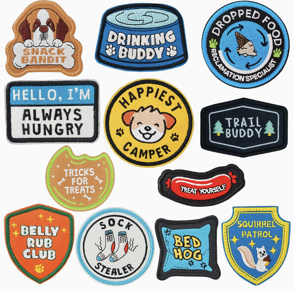 Collection of colorful dog-themed patches on a white background